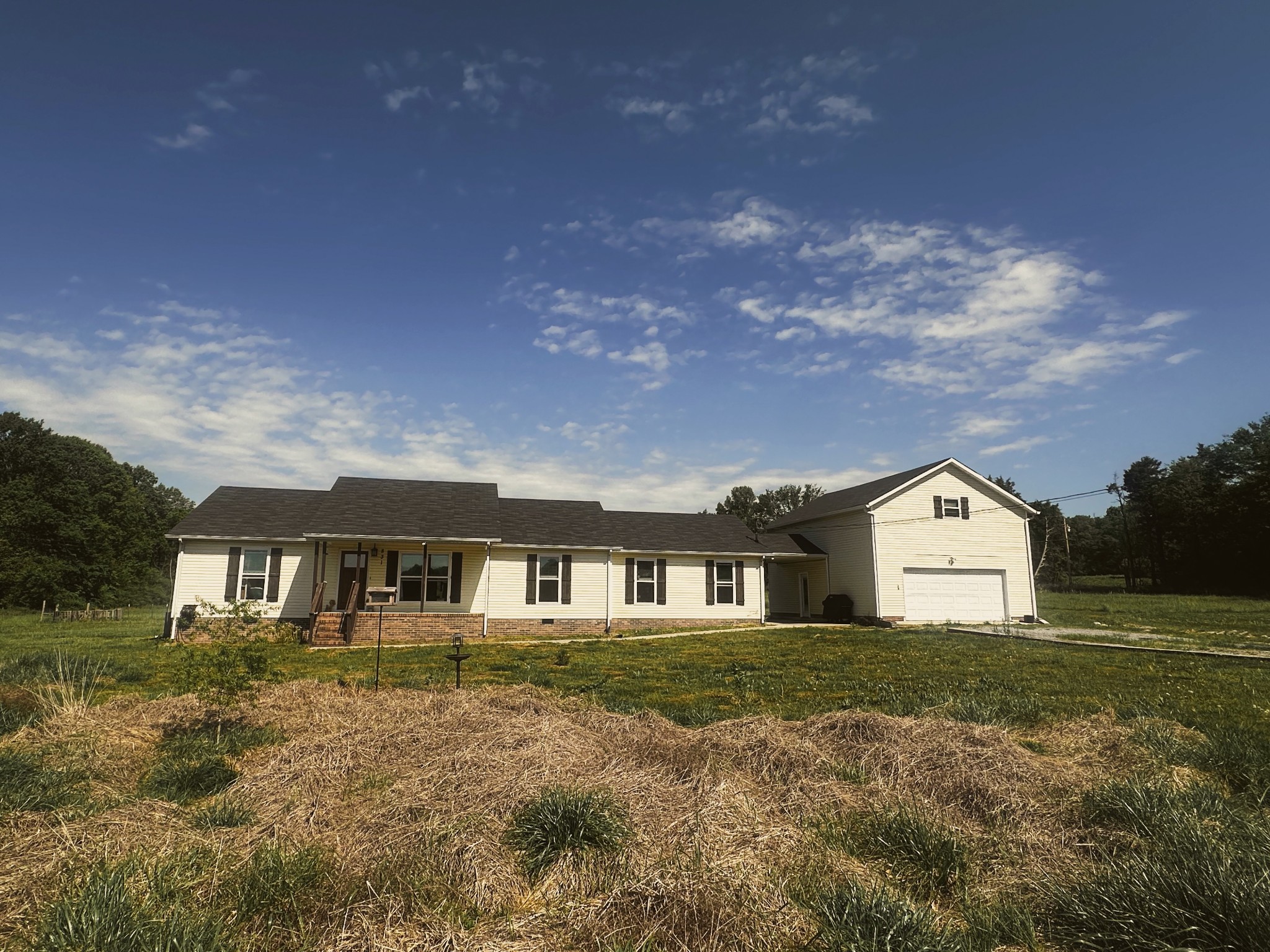 831 Philippi Road Wartrace, TN 37183 - Photo 5 of 51 a view of house with a big yard and large trees