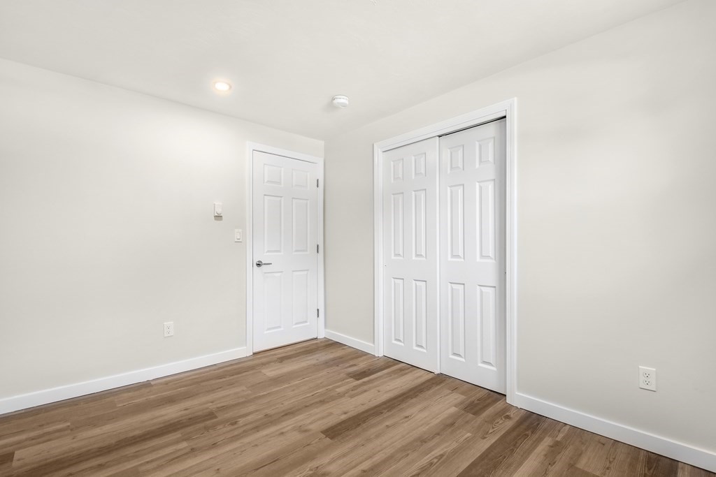 14 Hall Road Webster, MA 01570 - Photo 14 of 26 a view of an empty room with wooden floor