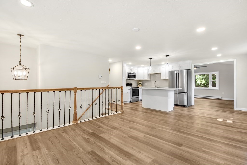 14 Hall Road Webster, MA 01570 - Photo 5 of 26 a view of a kitchen with a sink and an oven