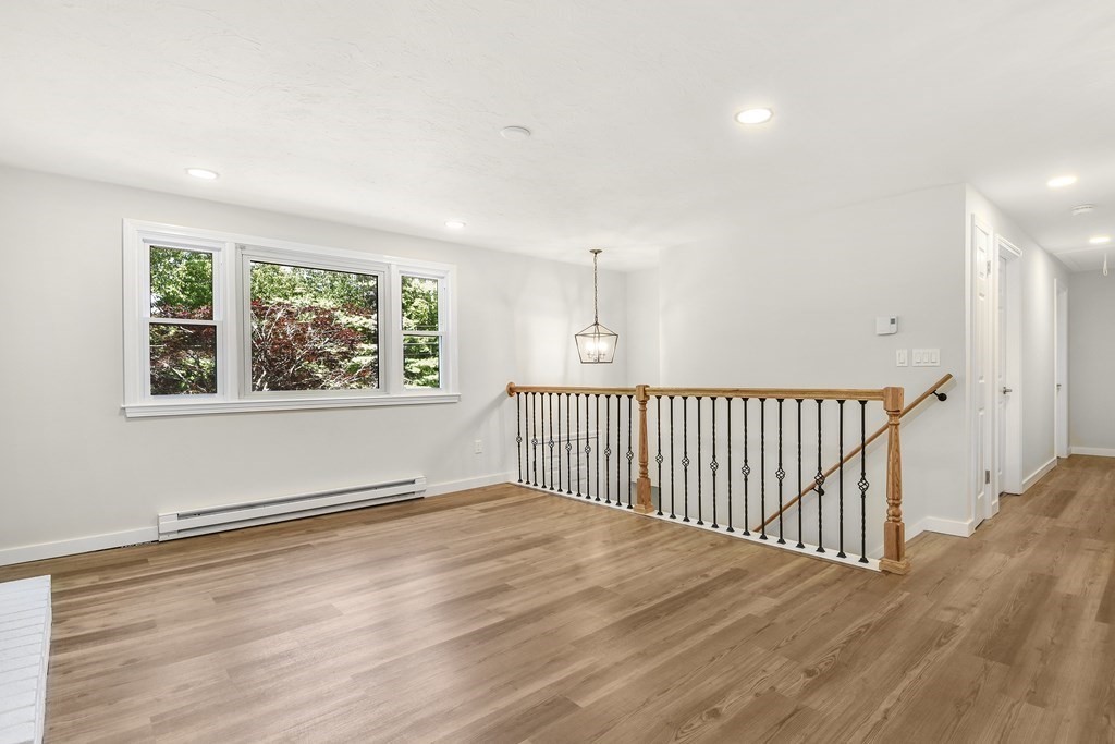 14 Hall Road Webster, MA 01570 - Photo 10 of 26 a view of an empty room with wooden floor and a window
