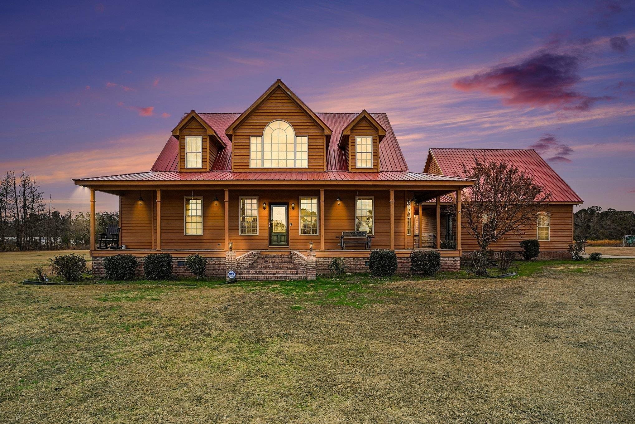 202 Highway 747 Loris Sc 29569 Loris, SC 29569 - Photo 1 of 34 Chalet / cabin with a porch, a yard, a metal roof, and crawl space