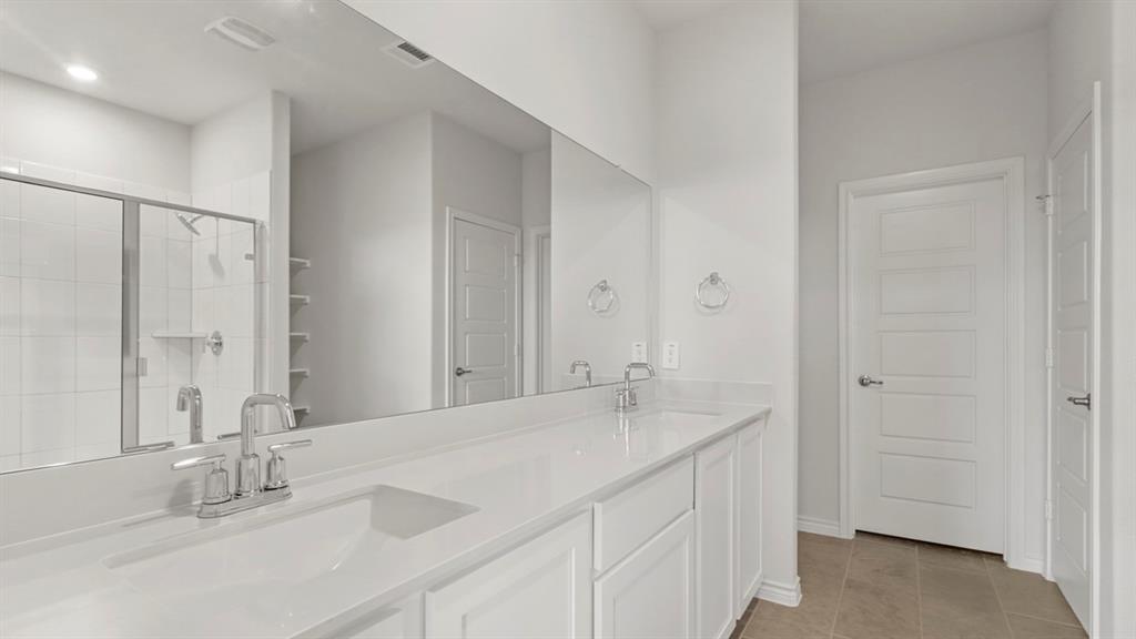 510 Range Road Caddo Mills, TX 75135 - Photo 15 of 25 a bathroom with a sink and a mirror