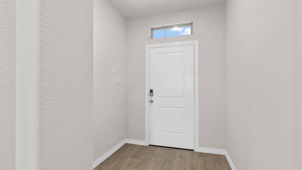 510 Range Road Caddo Mills, TX 75135 - Photo 16 of 25 a view of a small space with wooden floor