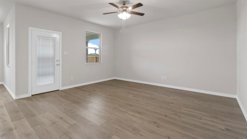 510 Range Road Caddo Mills, TX 75135 - Photo 19 of 25 wooden floor in an empty room with a window