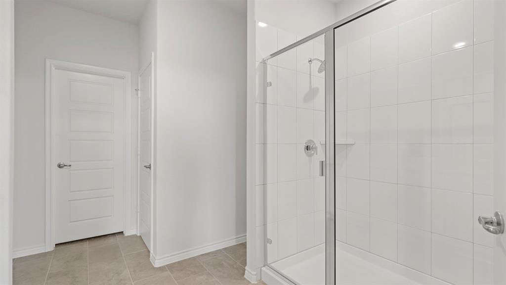510 Range Road Caddo Mills, TX 75135 - Photo 2 of 25 a bathroom with a shower and a glass door