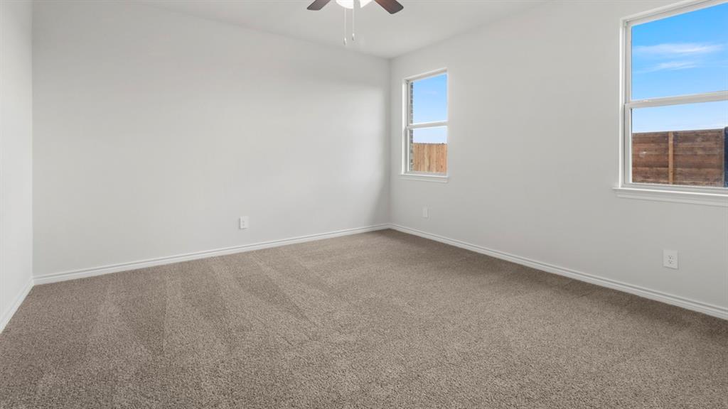 510 Range Road Caddo Mills, TX 75135 - Photo 21 of 25 an empty room with windows