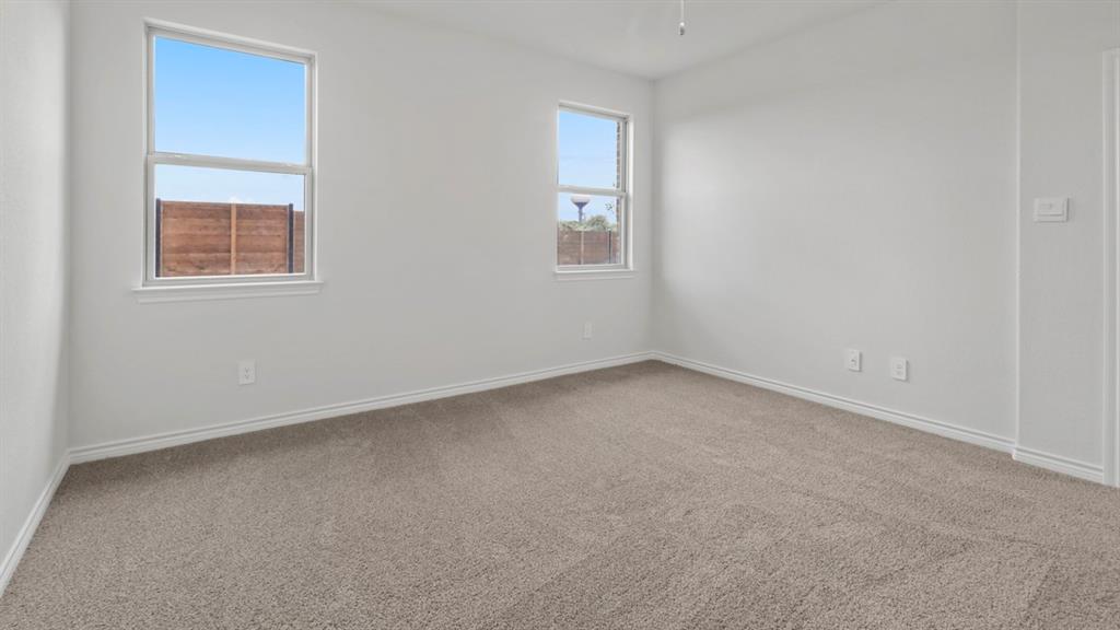 510 Range Road Caddo Mills, TX 75135 - Photo 22 of 25 an empty room with windows