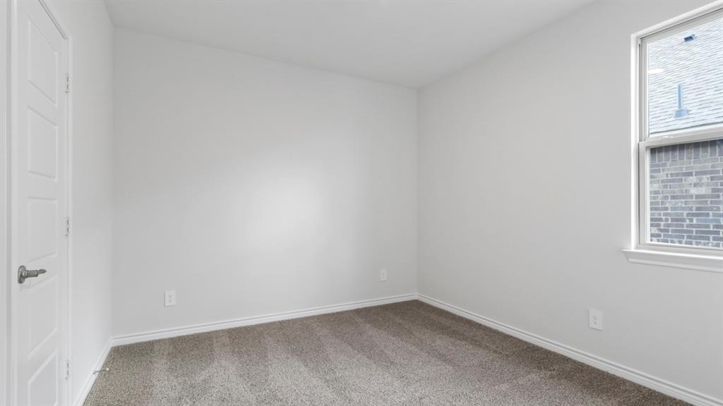 510 Range Road Caddo Mills, TX 75135 - Photo 10 of 25 an empty room with windows