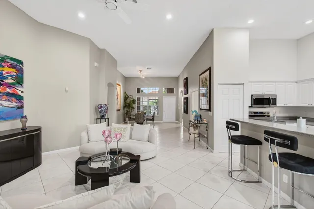 a kitchen with stainless steel appliances granite countertop a sink and cabinets