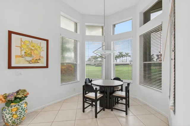 a spacious bedroom with a bed and a window