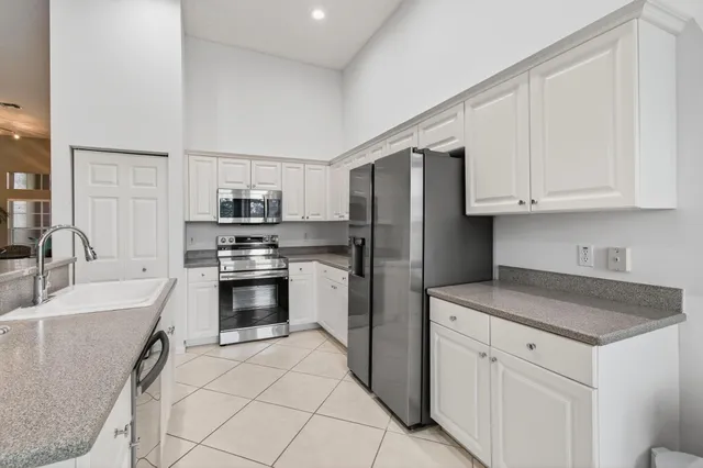 a bathroom with a double vanity sink mirror and double