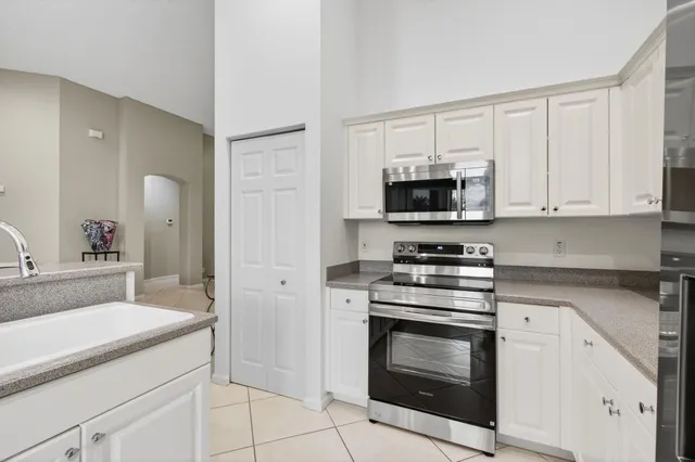 a utility room with sink dryer and washer