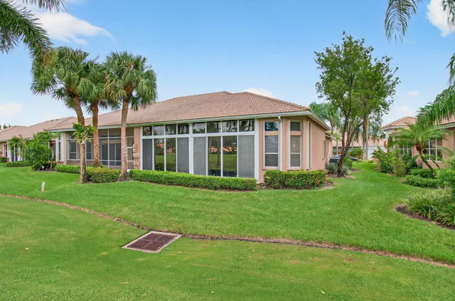 a front view of a house with a yard table and chairs