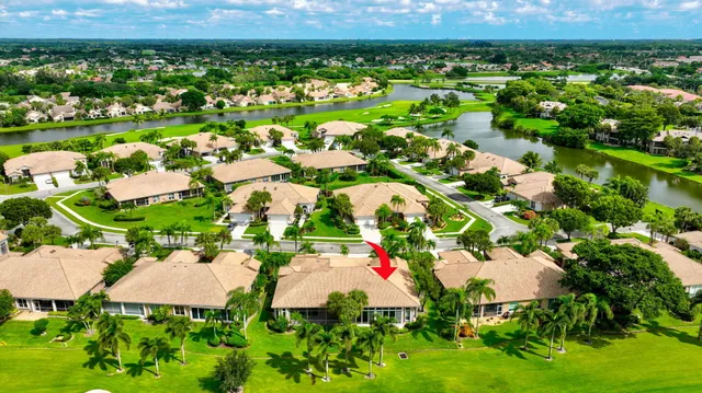 a living room with lots of furniture and a large window