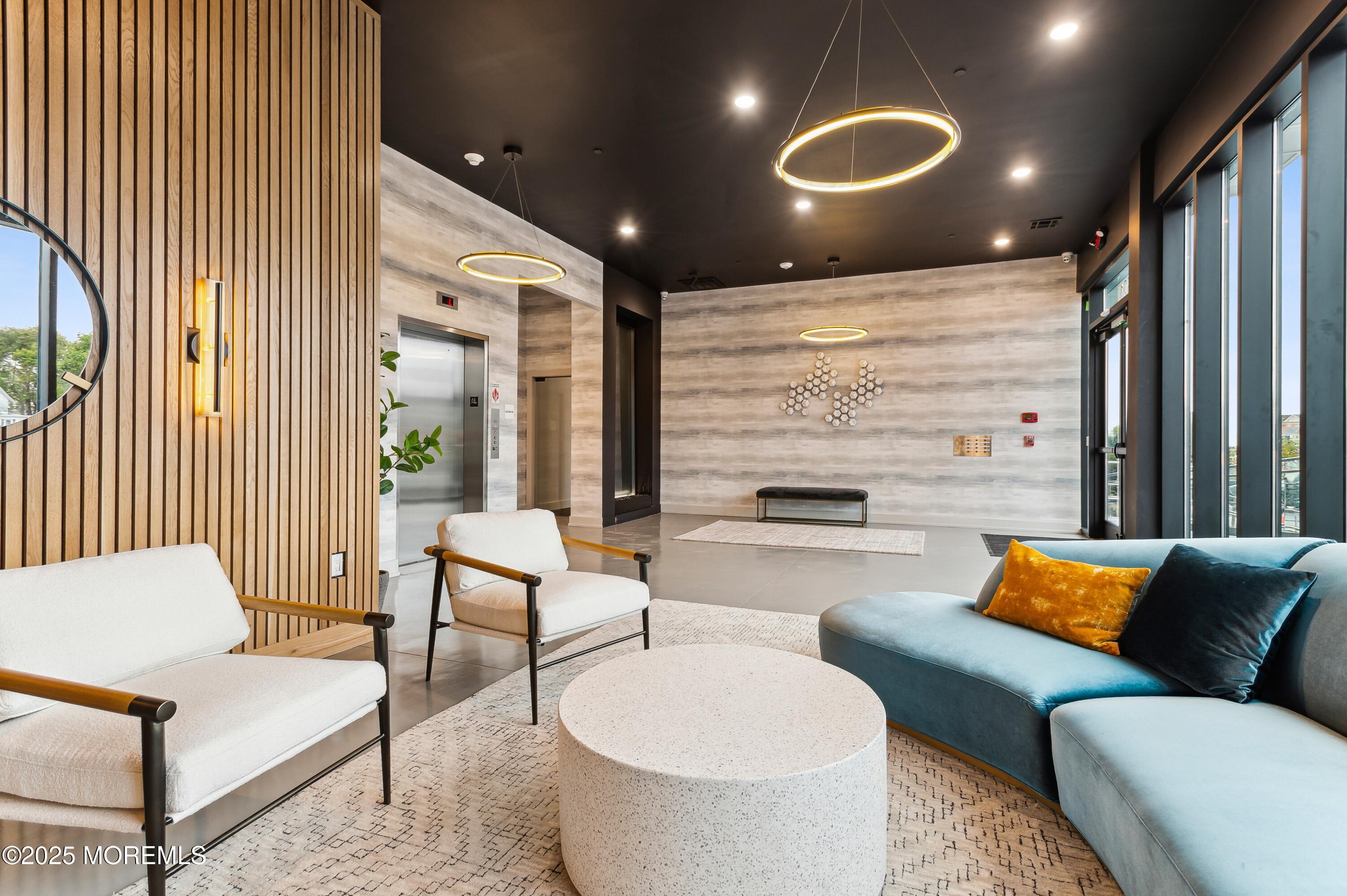 521 Lake Avenue, Unit 408 Asbury Park, NJ 07712 - Photo 25 of 30 a living room with furniture and a large window