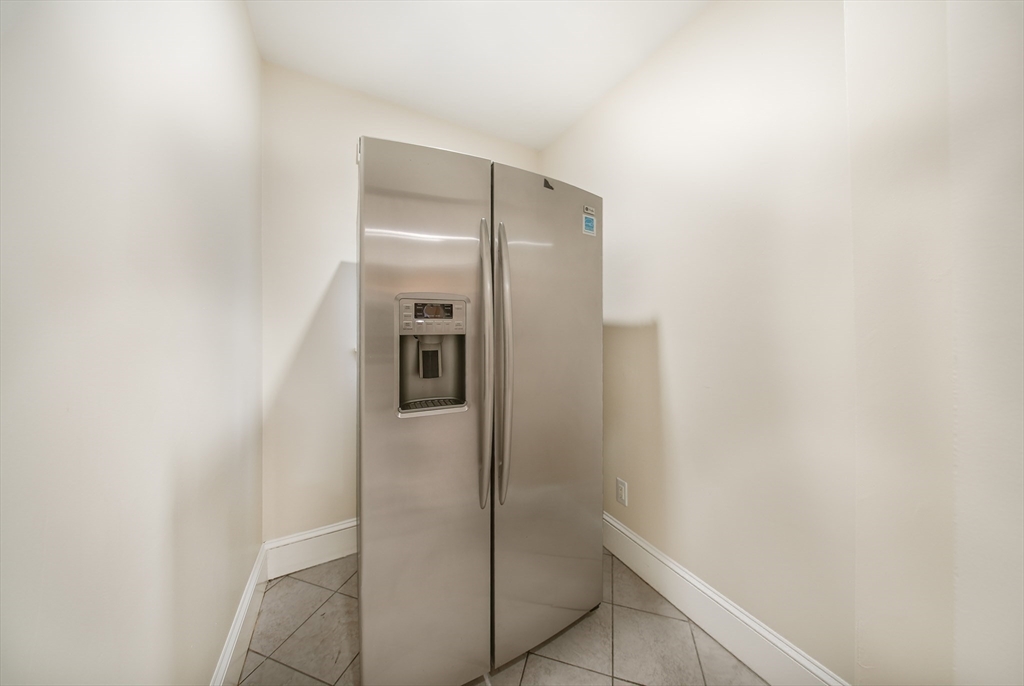 39 McDonald Street, Unit 39 Quincy, MA 02169 - Photo 4 of 15 a bathroom with a shower and a sink