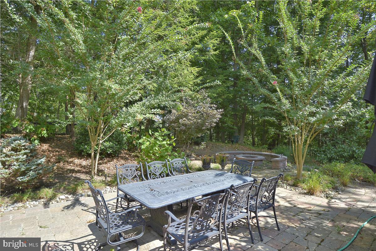 738 Intrepid Way Davidsonville, MD 21035 - Photo 12 of 71 a patio with table and chairs and potted plants