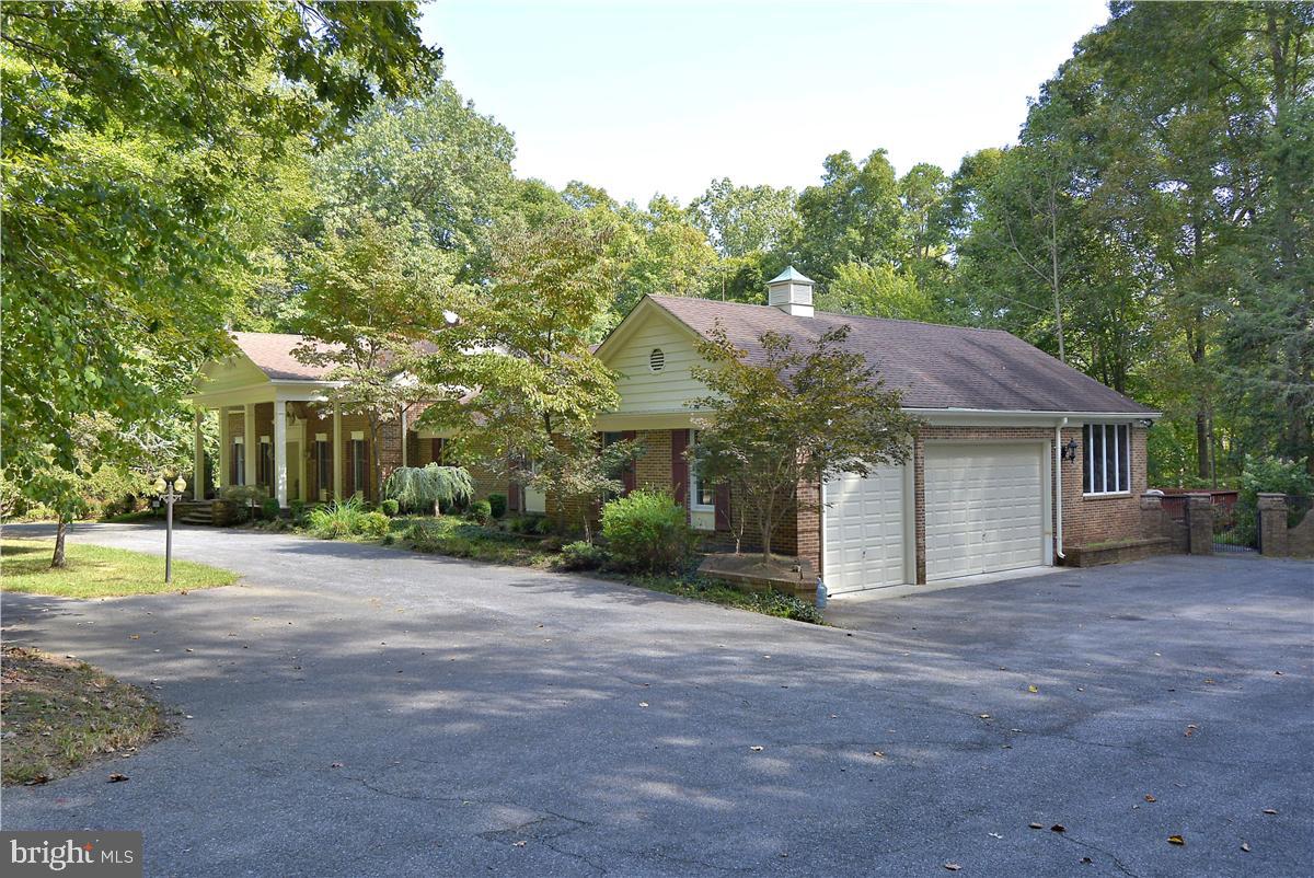 738 Intrepid Way Davidsonville, MD 21035 - Photo 4 of 71 a front view of a house with a yard and garage