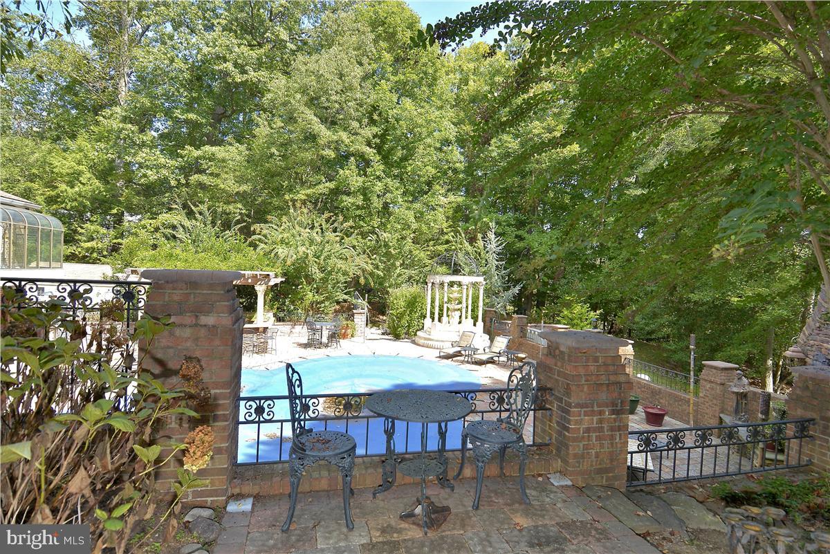 738 Intrepid Way Davidsonville, MD 21035 - Photo 45 of 71 a view of a patio with table and chairs