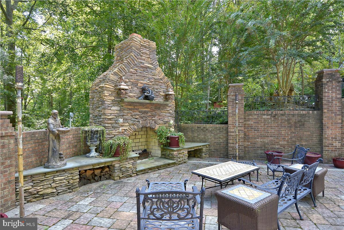 738 Intrepid Way Davidsonville, MD 21035 - Photo 47 of 71 a view of a patio with table and chairs and potted plants