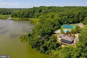 738 Intrepid Way Davidsonville, MD 21035 - Photo 69 of 71 an aerial view of a house with a yard and lake view