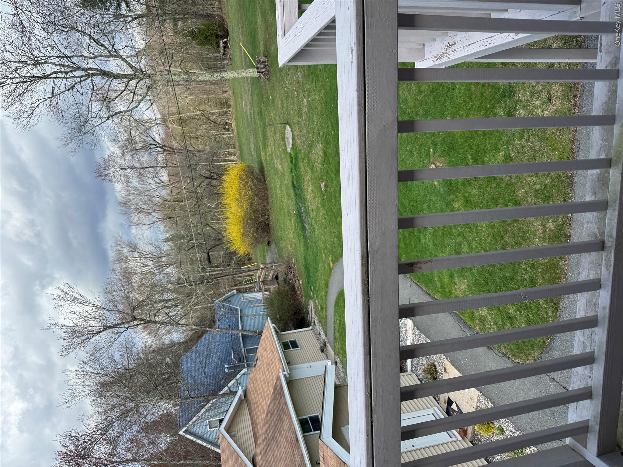 a view of a swimming pool with a yard