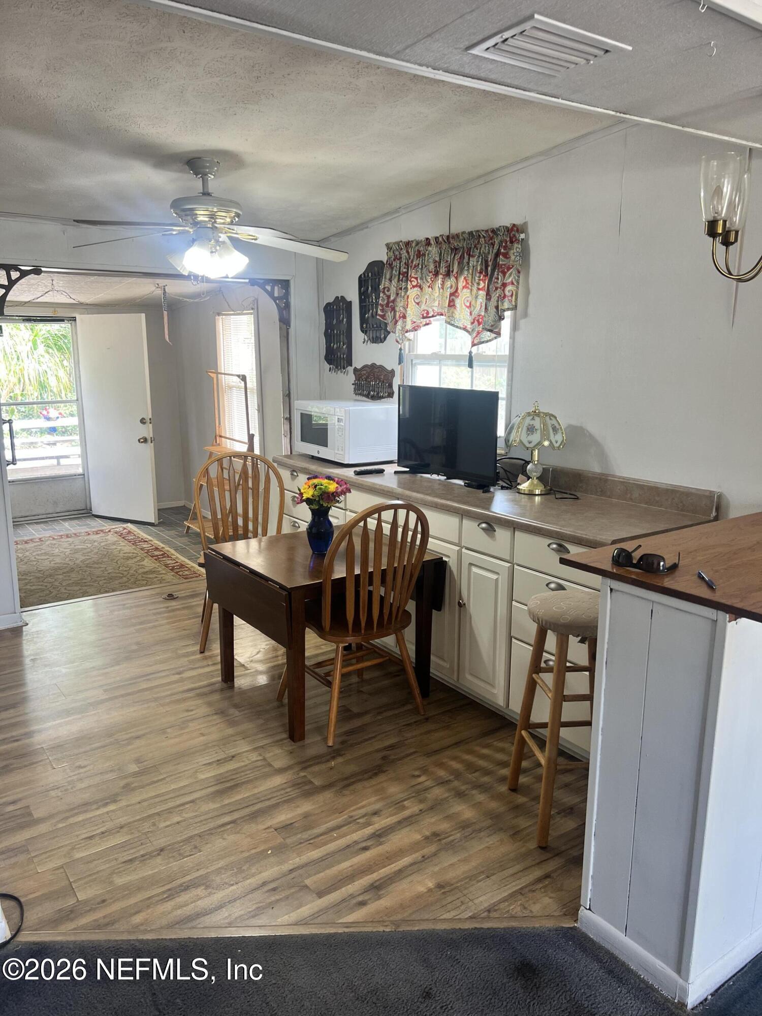 43 Forrestal Circle North Atlantic Beach, FL 32233 - Photo 8 of 39 a view of a dining room with furniture and window