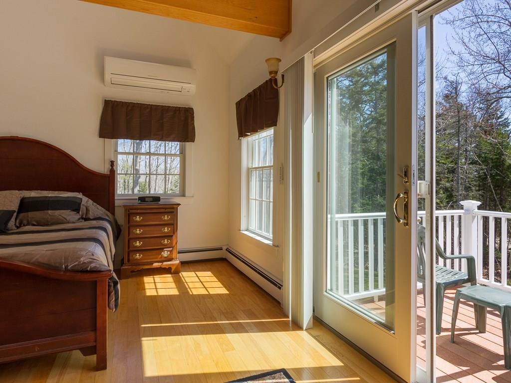 86 Spring Hill Loop Chamberlain, ME 04541 - Photo 10 of 35 Master bedroom with own deck.