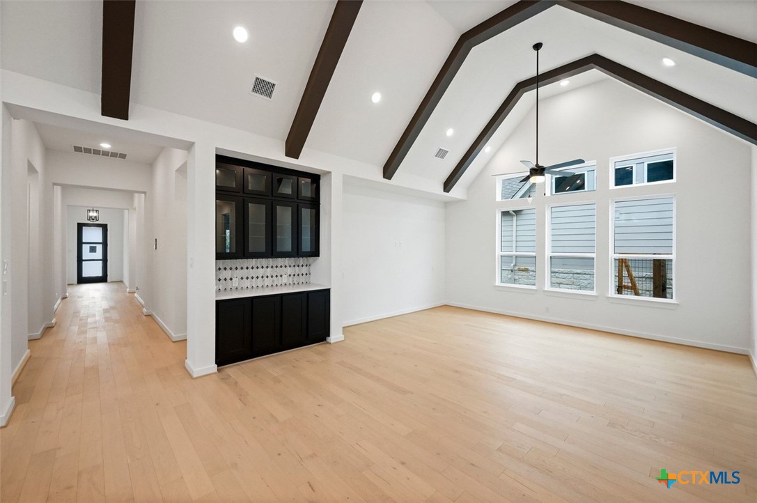 12213 Moon Pool Schertz, TX 78154 - Photo 19 of 25 a view of an empty room with a fireplace and a window