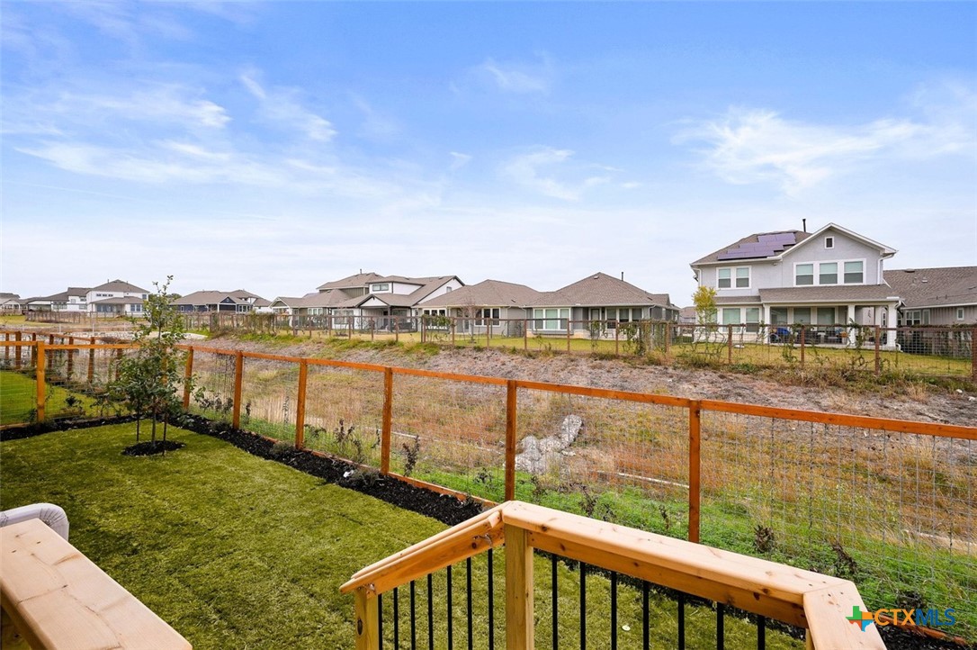 12213 Moon Pool Schertz, TX 78154 - Photo 22 of 25 a view of a lake with houses in the back