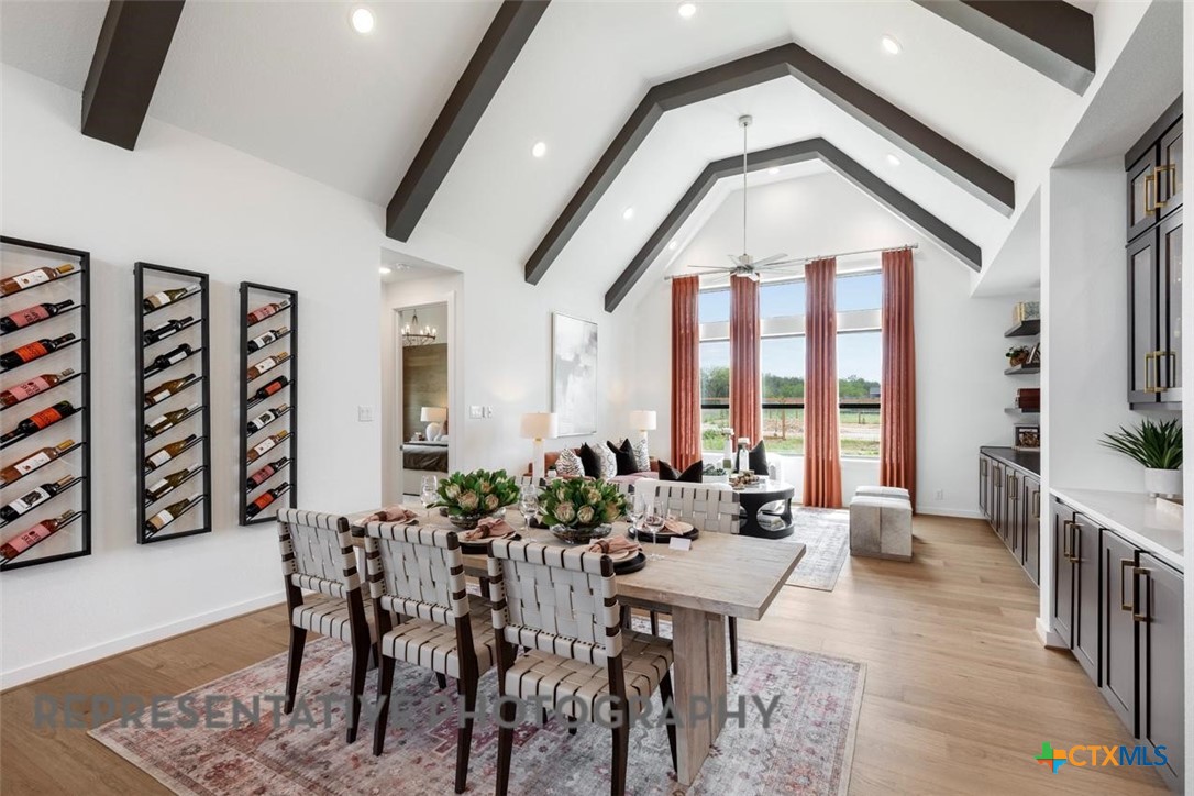12213 Moon Pool Schertz, TX 78154 - Photo 23 of 32 a view of a dining room with furniture window and wooden floor