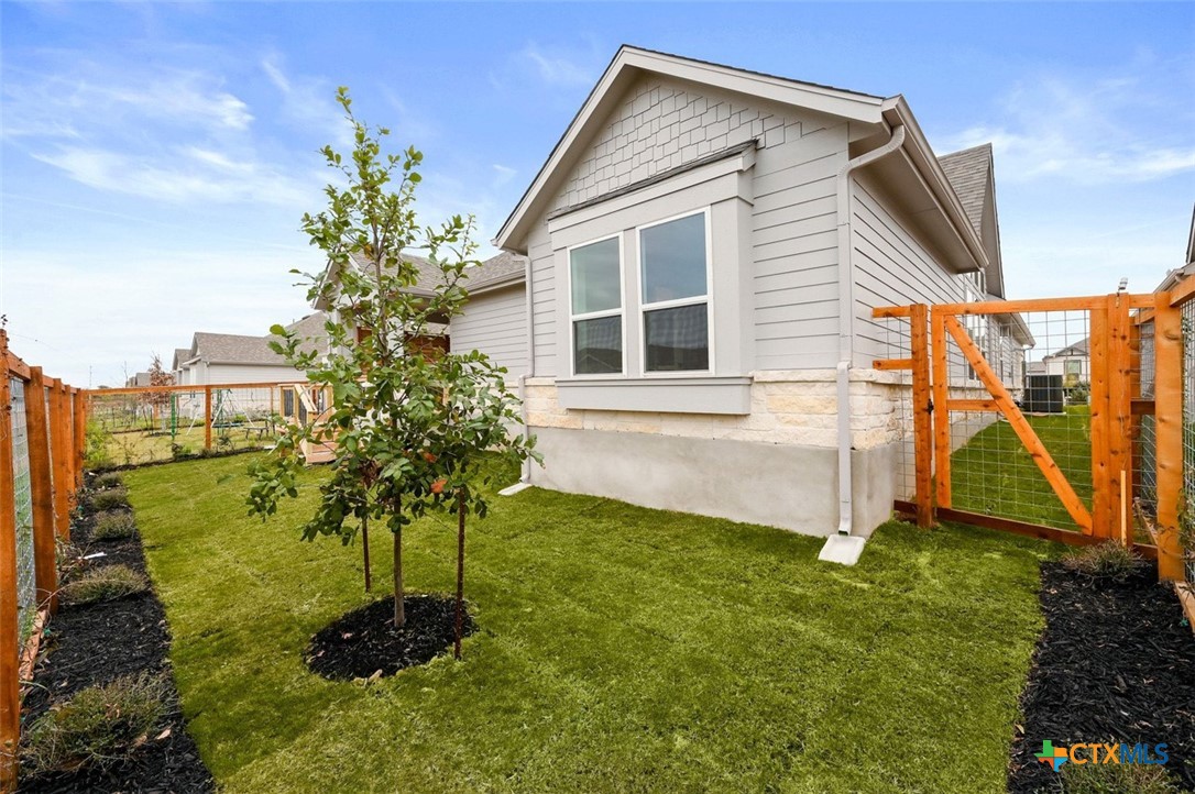 12213 Moon Pool Schertz, TX 78154 - Photo 24 of 25 a view of a house with a yard
