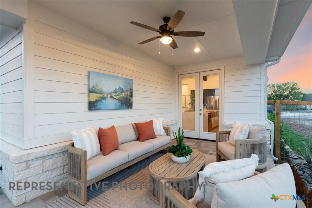 12213 Moon Pool Schertz, TX 78154 - Photo 29 of 32 a living room with furniture and a ceiling fan
