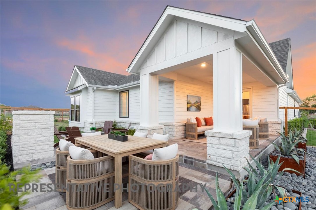 12213 Moon Pool Schertz, TX 78154 - Photo 30 of 32 a backyard of a house with table and chairs