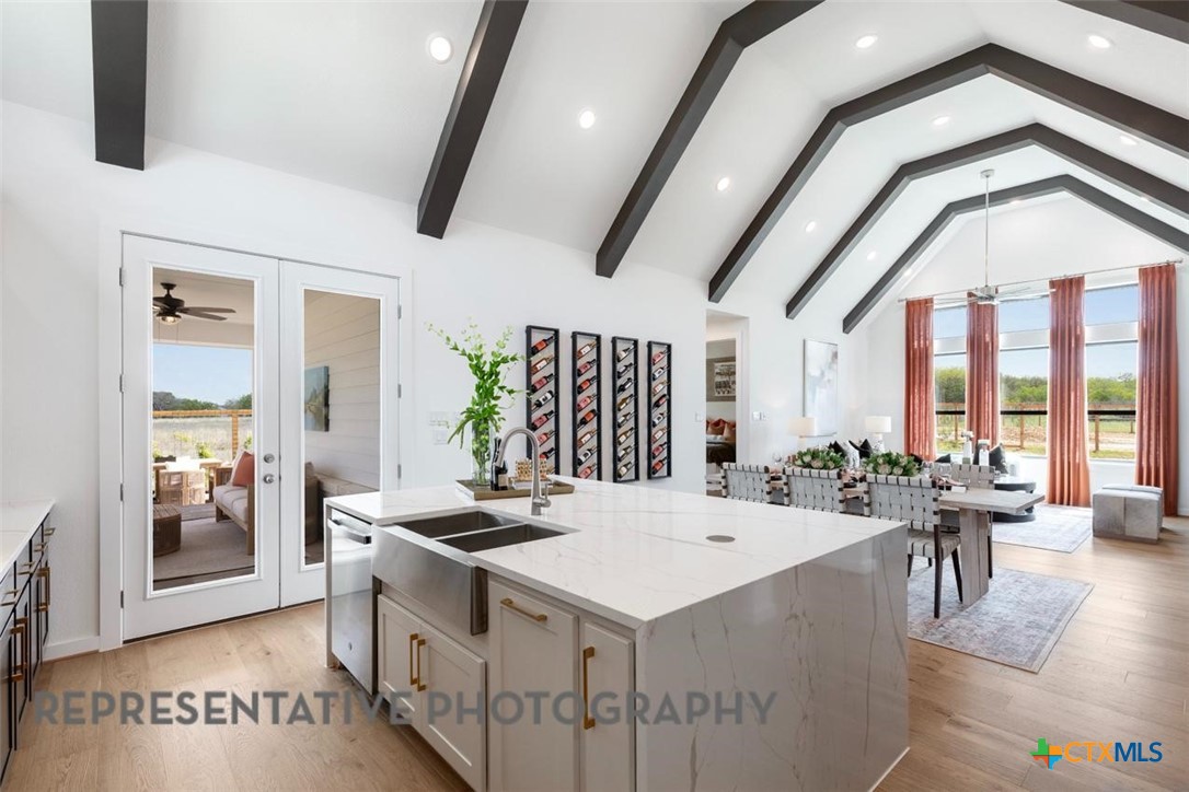 12213 Moon Pool Schertz, TX 78154 - Photo 4 of 32 a large white kitchen with a large window