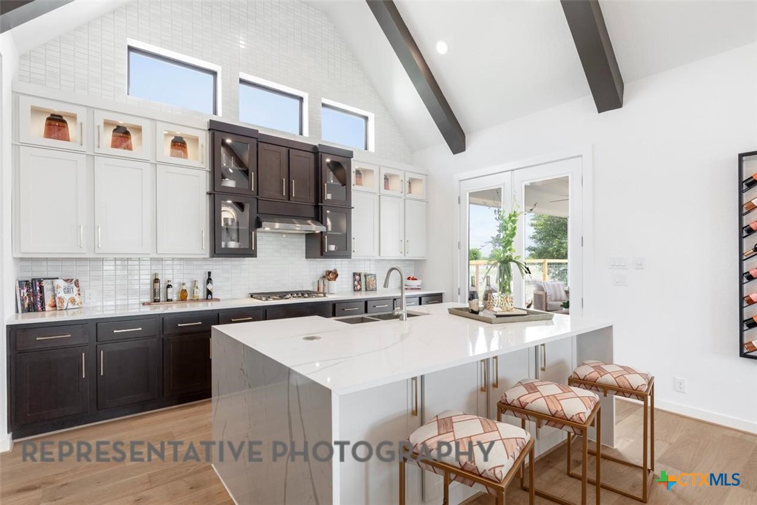 12213 Moon Pool Schertz, TX 78154 - Photo 7 of 32 a kitchen with a sink and chairs