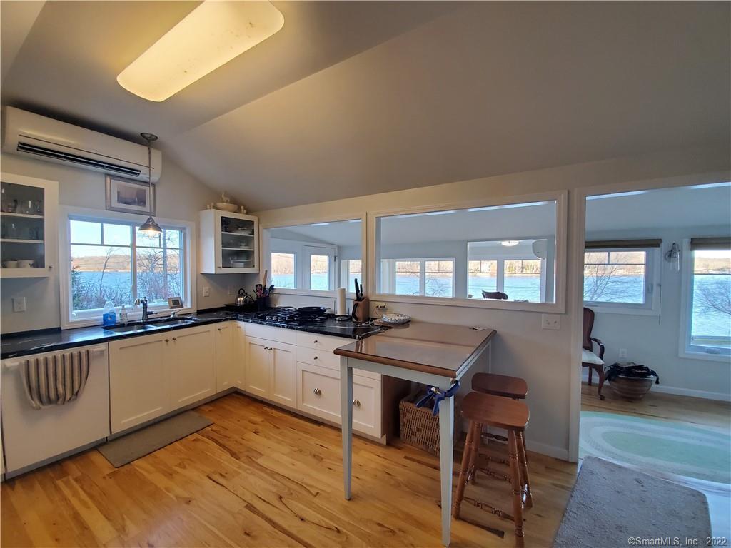 a large kitchen with a table and chairs in it