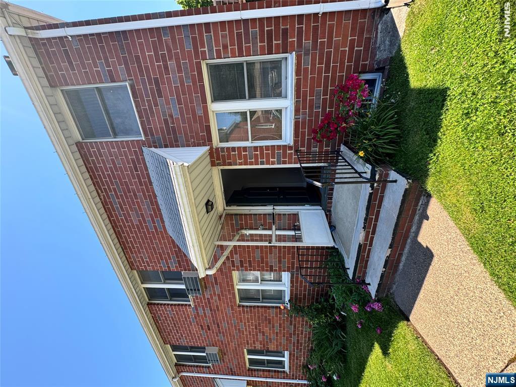 251 Fort Lee Road, Unit D Teaneck, NJ 07666 - Photo 2 of 14 a front view of a house with garden