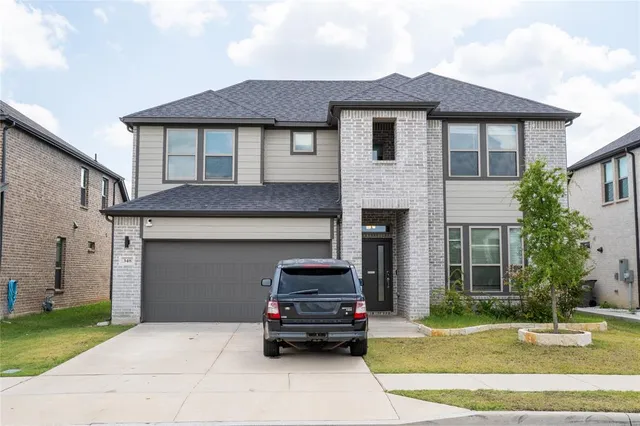 a car parked in front of a house
