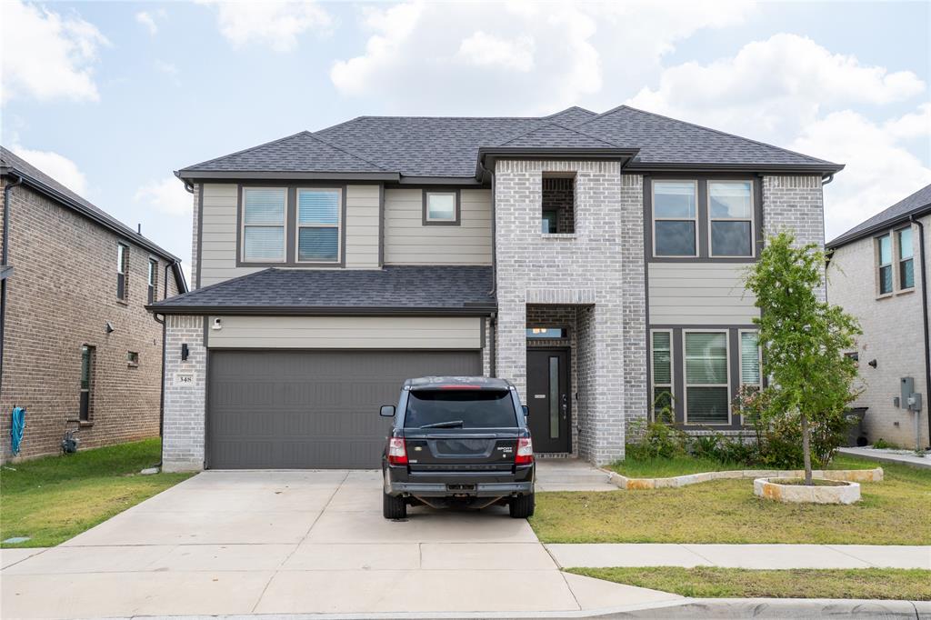 348 Braves Way Lavon, TX 75166 - Photo 1 of 29 a car parked in front of a house
