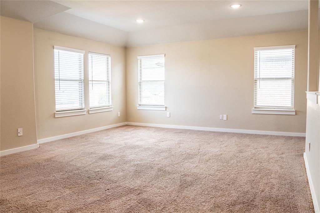 348 Braves Way Lavon, TX 75166 - Photo 11 of 29 an empty room with windows