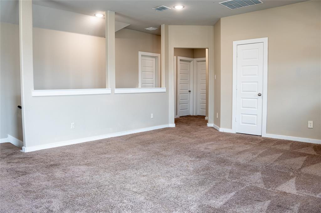 348 Braves Way Lavon, TX 75166 - Photo 20 of 29 an empty room with windows and closet