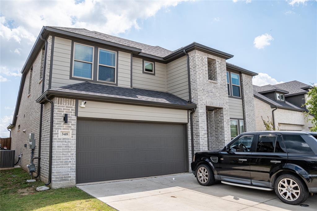 348 Braves Way Lavon, TX 75166 - Photo 2 of 29 a car parked in front of a house