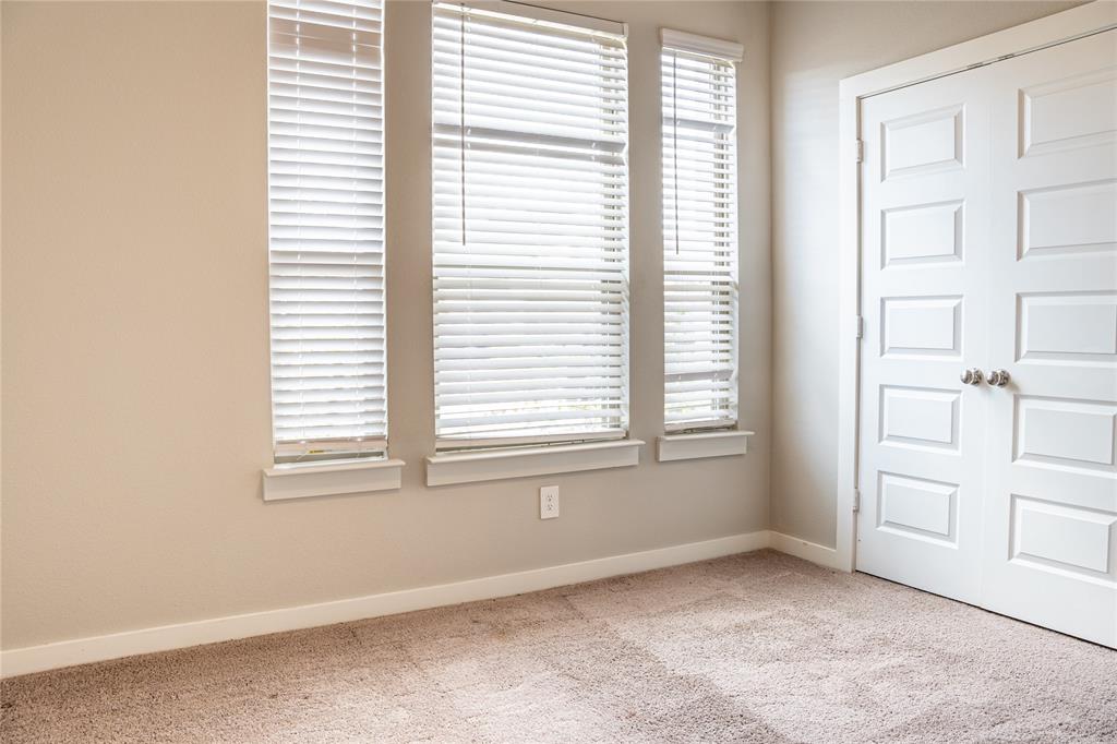 348 Braves Way Lavon, TX 75166 - Photo 23 of 29 an empty room with windows