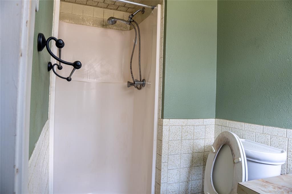 348 Braves Way Lavon, TX 75166 - Photo 24 of 29 a bathroom with a toilet and a shower