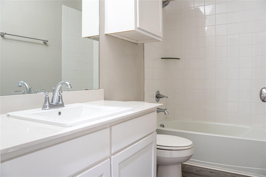 348 Braves Way Lavon, TX 75166 - Photo 25 of 29 a bathroom with a sink a toilet and shower