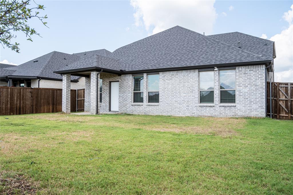 348 Braves Way Lavon, TX 75166 - Photo 29 of 29 a front view of a house with garden