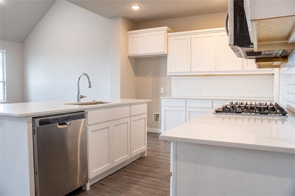 348 Braves Way Lavon, TX 75166 - Photo 8 of 29 a kitchen with a sink cabinets and appliances