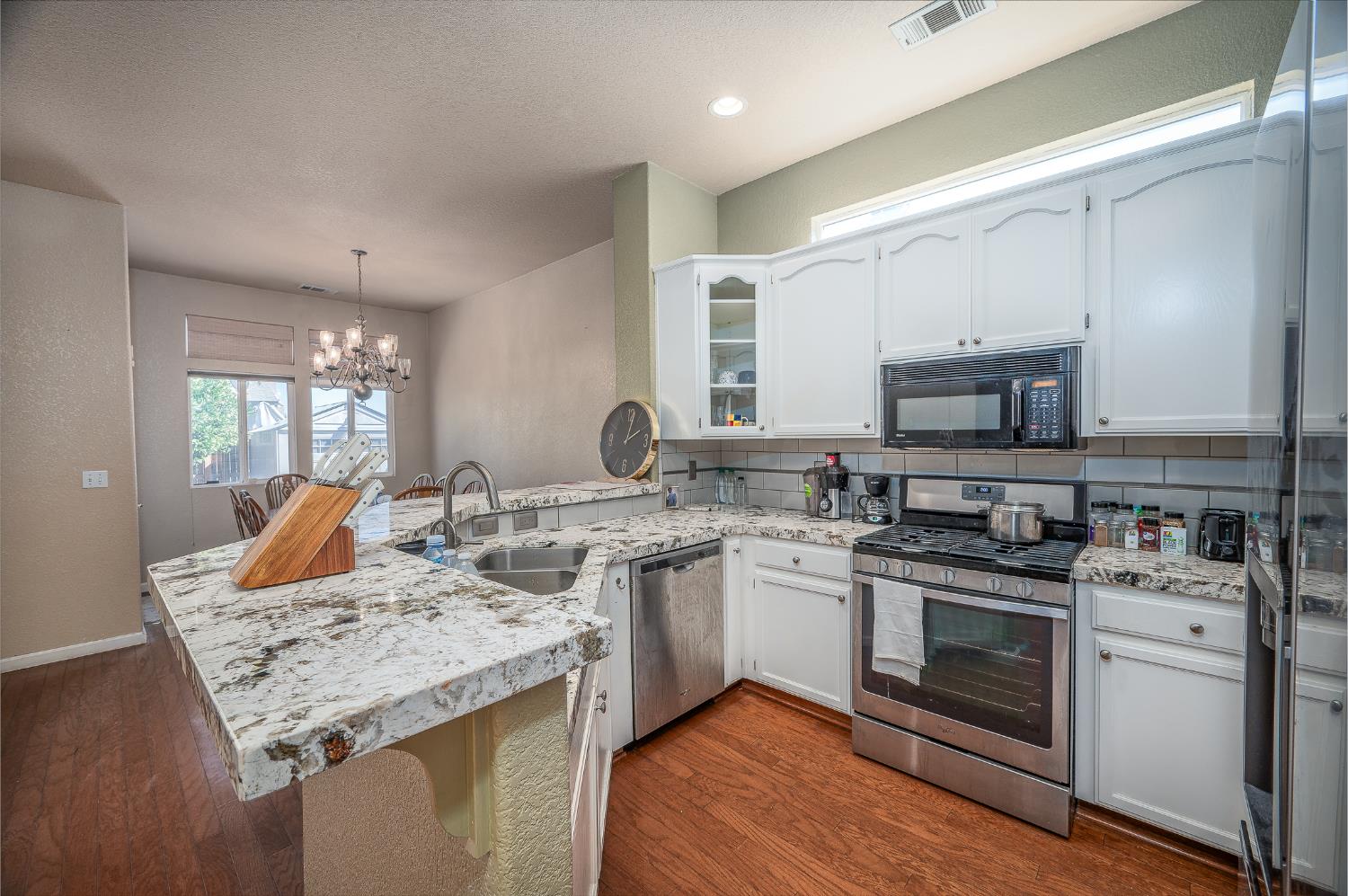 4160 Donovan Way Turlock, CA 95382 - Photo 1 of 1 a kitchen with a sink stove and microwave