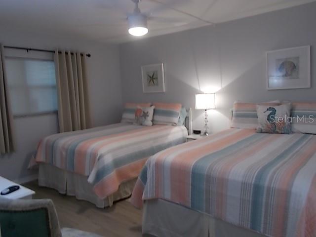 14001 Gulf Boulevard, Unit 407 Madeira Beach, FL 33708 - Photo 16 of 39 a bedroom with a bed and a walk in closet